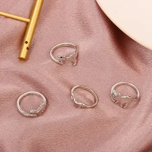 Stylish 4-piece silver dinosaur and animal theme open rings set for fashionable women
