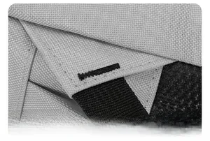 Detail shot of heavy-duty reinforced stitching on grey fabric for durable backpack use