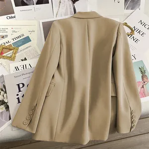 Detail view of khaki blazer back featuring a center seam and four-button cuffs