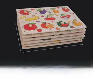 Macro detail of stacked wooden fruit puzzles for toddlers with small grab pegs