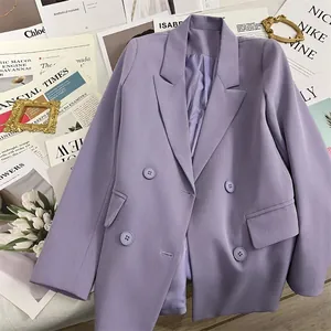 Lavender purple double-breasted blazer for women in a flat lay with stylish props