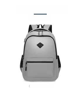 Front view of light gray travel backpack with black zippers and breathable mesh straps