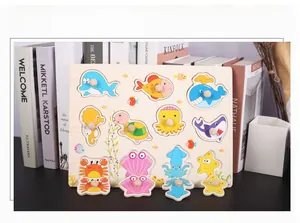 Macro detail of wooden sea animal puzzle board with round knobs for toddler learning