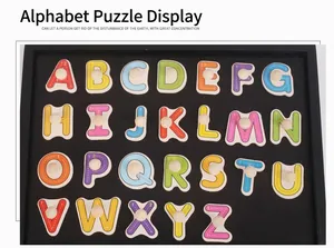 Macro detail of 26 uppercase alphabet wood puzzle pieces with knobs and stroke guides