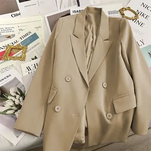 Double-breasted khaki blazer for women featuring classic notched lapels and flap pockets