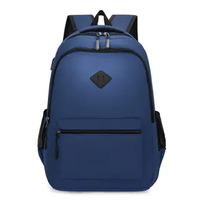 Sac à dos bleu de voyage haute capacité en nylon résistant avec patch et poches filet