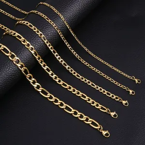 Macro view of five different widths of golden Figaro chains with lobster clasps
