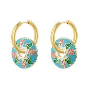 Vintage gold hoop earrings with light blue enamel floral charms and pink flower petals