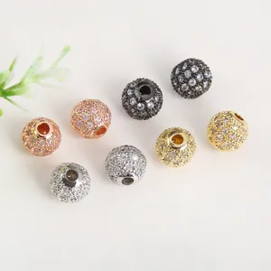 Macro shot of 18K gold plated micro-pave zircon beads for DIY jewelry making
