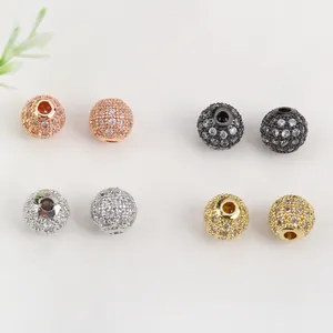 Detail view of 18K gold plated micro-pave zircon spacer beads in four metallic colors