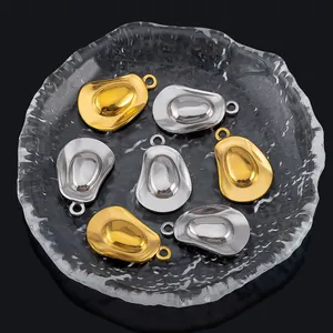 Detailed view of gold and silver cowboy hat charms with polished metal finish
