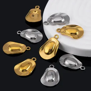 Macro detail of polished gold and silver cowboy hat pendants for DIY jewelry making