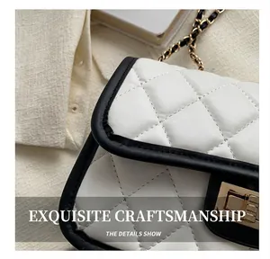 Detail of rhombic quilting and premium stitching on black and white chain bag