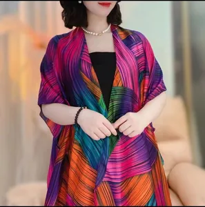 Detailed view of colorful satin sun protection shawl with elegant floral prints