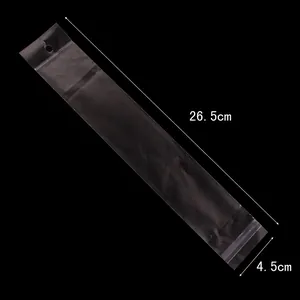 Macro view of clear long OPP plastic bags with dimensions 26.5x4.5cm and hang hole