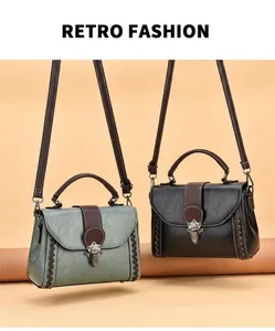 Close-up of retro square handbags in black and green with woven edges and metal locks