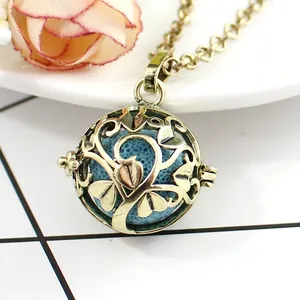 Macro detail of antique gold hollow locket with blue aroma stone on elegant base