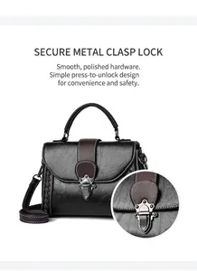 Detail of the brown lychee leather handbag featuring its secure metal push-lock buckle