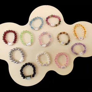 Detailed collection of beaded cat rings with natural stones and pearl cat head charms