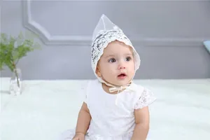 Close-up of delicate white lace embroidery and texture on the baby princess hat