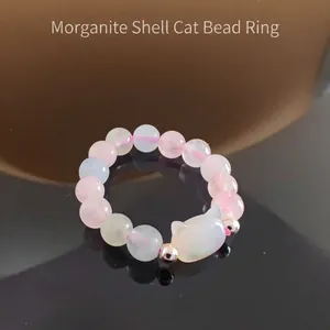 Close-up of Morganite beads and shell cat charm detail on this trendy beaded ring