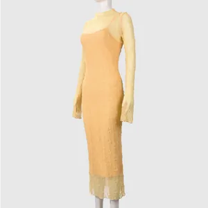 Detailed close-up of yellow lace dress fabric with delicate embroidery and high neck