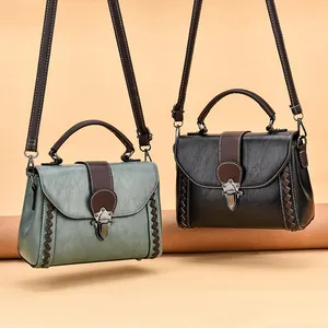 Chic women shoulder bags in vintage green and black with textured leather and stitching