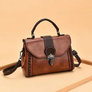 Retro brown leather crossbody bag with woven details and metal buckle for women