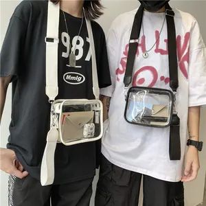 Trendy transparent PVC crossbody jelly bag with wide adjustable fabric shoulder strap