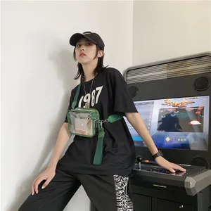Green transparent PVC crossbody bag with wide strap and inner pouch for women