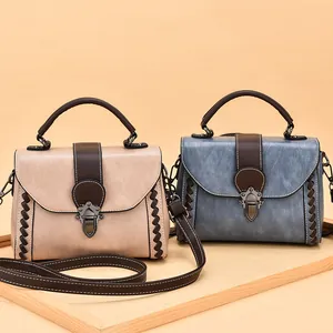 Retro women's crossbody bag with textured faux leather, metal buckle and woven details