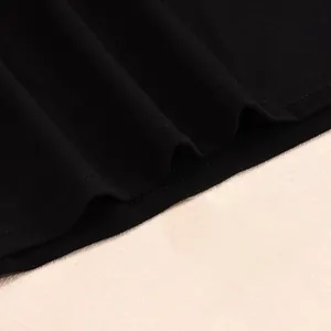 Close-up of double-needle stitching and high-quality black knitted fabric texture