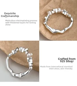 Detail of S925 sterling silver wave ring with freshwater pearls and silver beads