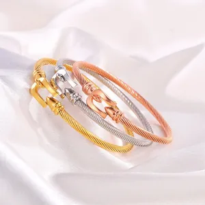 Three-color cable twist bracelets in gold, silver, and rose gold with horseshoe buckles