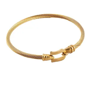 Gold titanium steel cable bracelet with minimalist horseshoe buckle for women
