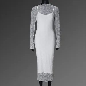 Detailed macro view of delicate white lace texture and long sleeves of the dress