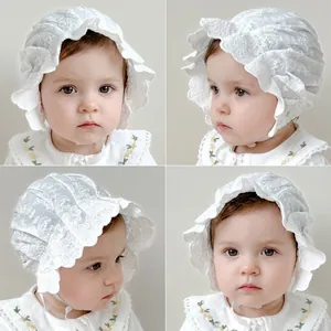 Detailed views of baby girl lace bonnet with delicate butterfly embroidery and ruffles