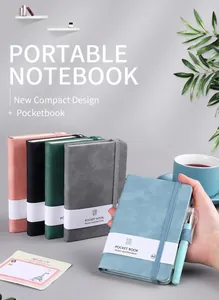Close-up of A6 pocket notebook with elastic strap, pen loop, and matching gel pen