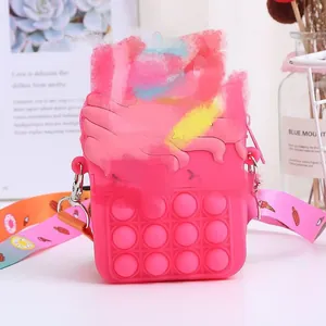 Pink silicone Pop It crossbody bag for kids with yellow star and sweet treats strap
