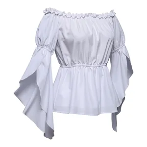 Detail of off-shoulder white top featuring ruffle neckline and dramatic bell sleeves