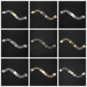 Close-up of stainless steel Cuban link bracelets with various engraved plate designs