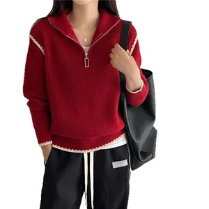 Red half-zip polo sweater with contrast stitch trim and a gold rectangular zipper
