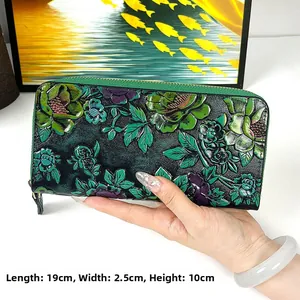 Detail shot of vintage leather floral wallet showing dimensions 19cm x 2.5cm x 10cm