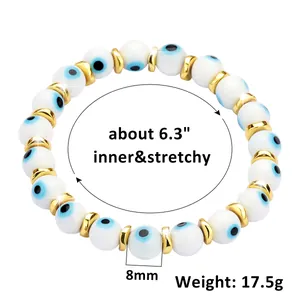 Detail view of 8mm blue evil eye beads with gold spacers on elastic bracelet