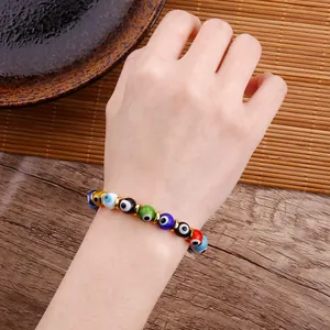 Detailed view of colorful Evil Eye beaded bracelet worn on a female wrist accessory