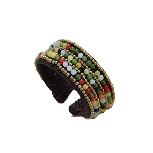 Handmade Bohemian wide woven cuff bracelet with colorful natural stones and golden beads