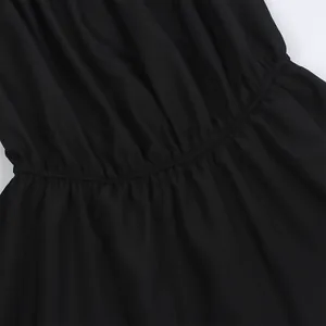 Close-up of black elastic waistband with fine pleats on off-shoulder summer top
