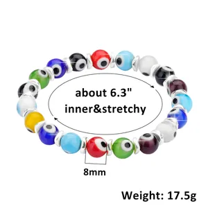 Detail view of 8mm colorful glass evil eye beads with elastic cord and silver spacers