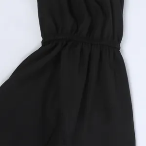 Detail of elastic ruffled cuff and black textured knit fabric on summer off-shoulder top