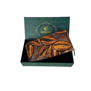 Vintage long leather wallet with embossed leaf patterns in a luxury green gift box
